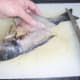 Removing the second fillet from the sea bream