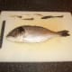 Removing the fins before filleting a sea bream is optional