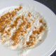 Flour is seasoned with remaining curry rub