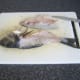 Second fillet is removed from the sea bream