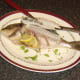 Tucking in to a whole baked sea bream