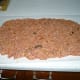roll out meat mixture on top of wax paper
