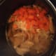 Add the carrot and garlic to the broth mix. Let it cook for 5 minutes.