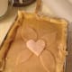 The center heart decoration in place on the top crust.