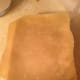 Roll the top crust onto the rolling pin and unroll it on the filled bottom crust.