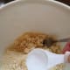 Add the next Tablespoon of water to another section of the bowl.