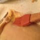 Using a pastry brush, brush the egg wash onto the edges on the crust.