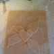 I chose leaves and a heart to decorate the top crust. Here I'm checking to make sure the decorations will fit.