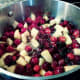 The cranberry-apple mixture is beginning to boil.