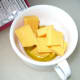 In an oven proof cup add the garlic infused olive oil, one ounce of cheddar cheese,and tablespoon of butter.