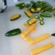 Slice and lay the old cheddar on top of the slice jalapeno peppers