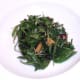 Salad is arranged as a bed for kangaroo meat