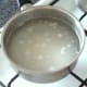 Rice is added to a pot of boiling, salted water