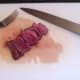 Kangaroo steak is thinly sliced