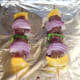 Kangaroo skewers are grilled on foil covered tray