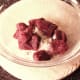 Kangaroo meat is tossed in seasoned flour