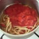 Tomatoes are added to sauteed onion mix