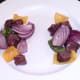 Kangaroo meat and vegetables removed from skewers