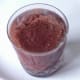 Chocolate and grape syrup is poured in to glass with vodka