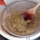 Straining blitzed watermelon and cucumber