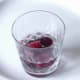 Vodka is poured over part frozen grapes
