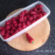 Fresh raspberries and red chilli pepper