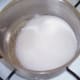 Sugar for sugar syrup is added to saucepan