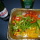 Toss the thinly sliced peppers into a bbq-safe roasting pan...a disposable aluminium one works great.