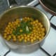 Coriander leaf/cilantro and garlic are added to chickpeas