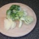 Sliced pak choi and onion