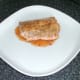 Salmon is laid on sauce bed