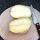Baked potato is cut in half along its length