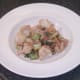 Sauteed cauliflower and pak choi are plated