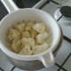 Boiled cauliflower florets are drained and left to steam