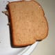 Cover with the buttered slice of bread.
