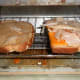 The buttered slice and cheese and turkey slice in the toaster oven.