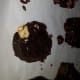 Remove a cookie log from the fridge, cut, and lay the slices on a parchment-lined cookie sheet.