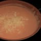 Step 5.4 Melt the cheese into the sauce 1/2 cup at a time