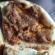 Fatayer laham is a pizza like crust topped with minced meat.