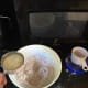 Notice that the oil and milk are separated, even if the presence of flour in the cup makes this less visible.