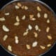 Step five: Pour the halwa into a greased plate. Keep aside for cooling. Garnish it with cashew nuts. Cut it in desired shapes.