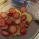 Cake sprinkled with vodka and toped with strawberries