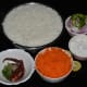 Step one: Keep the ingredients ready. Immerse cooked rice on a plate.