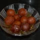 Step nine: Serve warm gulab jamun in a steel or glass bowl. Enjoy eating!