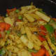 Step four: Add capsicum and parboiled baby corn. Continue stir-cooking for 5-6 minutes.
