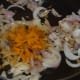 Step three: Throw chopped onions into the pan. Stir-fry till they become transparent. Add turmeric powder.