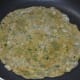 Step 4: Heat few drops of oil in a pan and place the disc on it. Cook until it develops bubbles on the surface.