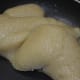 Add the remaining ghee. This is the last stage of cooking this sweet. The mix comes together like a single mass.