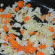 Step 3: Sauté chopped carrot and cabbage in butter.