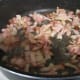 Bacon in the frying pan over medium heat
